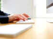 Female hands typing on computer keyboard