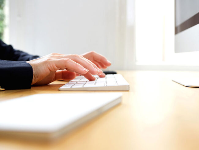 female-hands-typing-on-computer-keyboard-PXY2UHE Female hands typing on computer keyboard