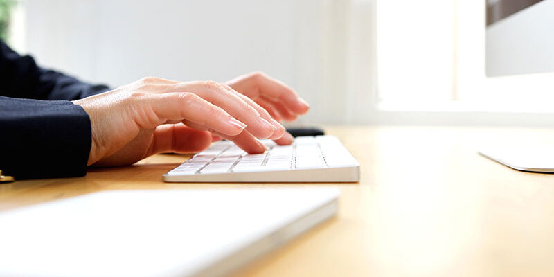 female-hands-typing-on-computer-keyboard-PXY2UHE Female hands typing on computer keyboard