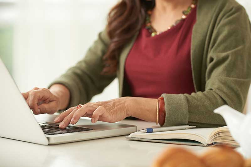 Woman typing on laptop