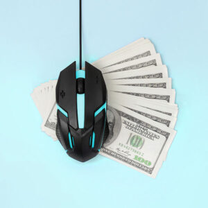 Cash underneath a mouse to represent pay-per-click
