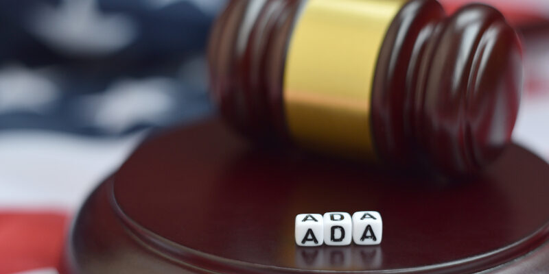 Judge's gavel beside blocks representing ADA accessible websites.