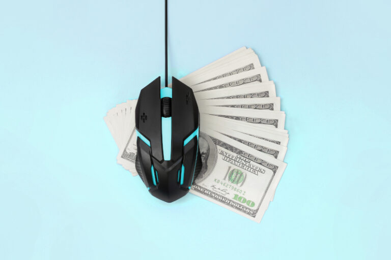 Mouse on top of money for pay-per-click ads