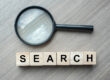A magnifying glass symbolizing search engine marketing.