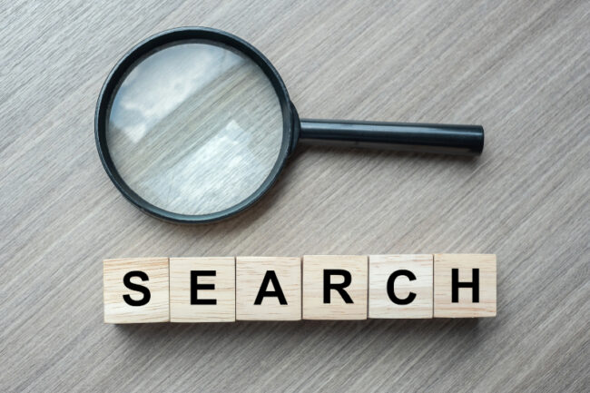 A magnifying glass symbolizing search engine marketing. A magnifying glass symbolizing search engine marketing.