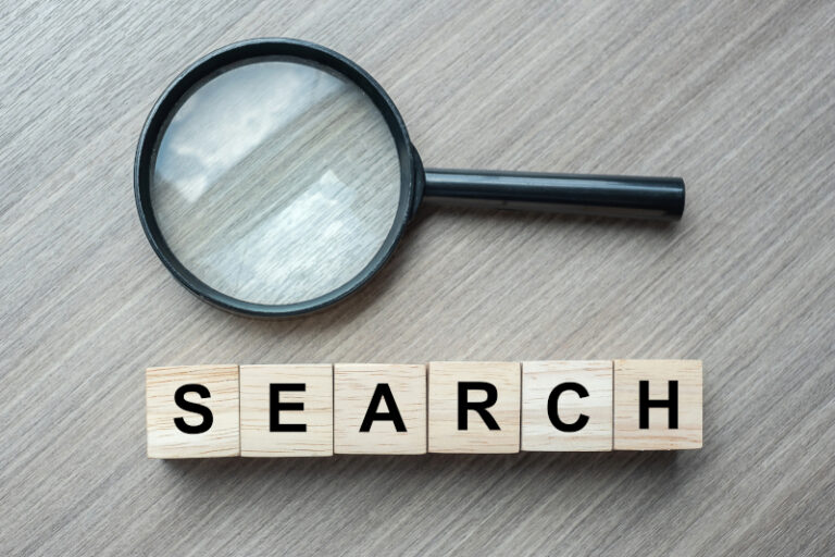 A magnifying glass symbolizing search engine marketing.