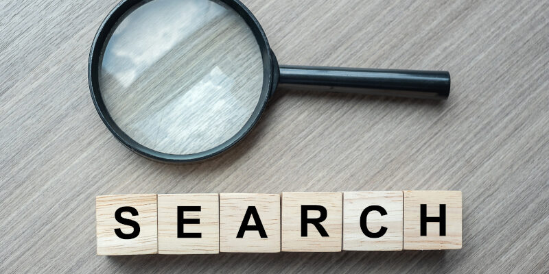 A magnifying glass symbolizing search engine marketing. A magnifying glass symbolizing search engine marketing.