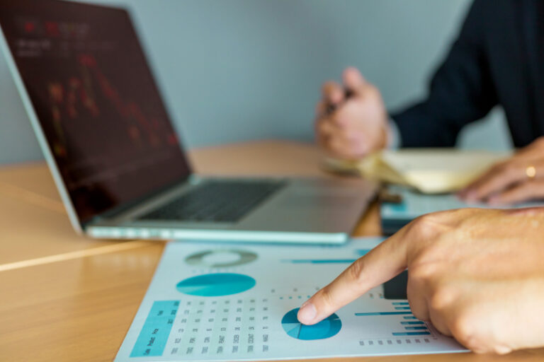 People performing an analysis of web design cost.