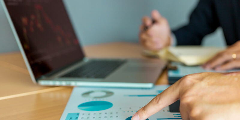 People performing an analysis of web design cost. People performing an analysis of web design cost.