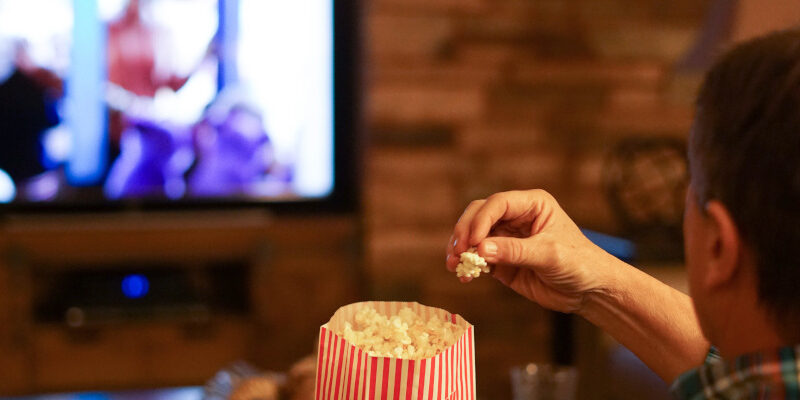 Man watching a movie for web design inspiration. Man watching a movie for web design inspiration.