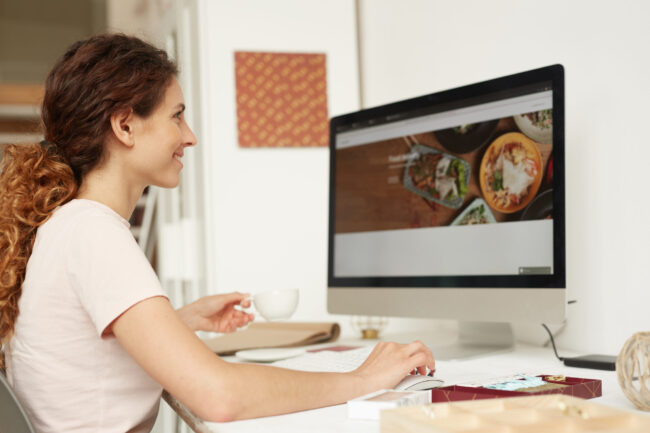 Web designer working on website. Web designer working on website.