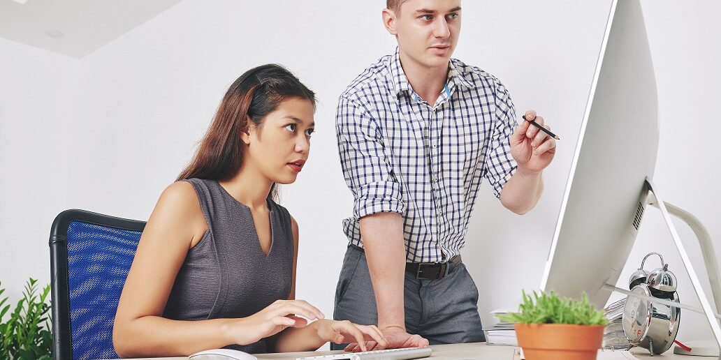 Designers discussing website interface Web developers discussing ADA compliance for web design